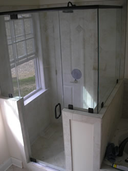 frameless shower enclosure with header