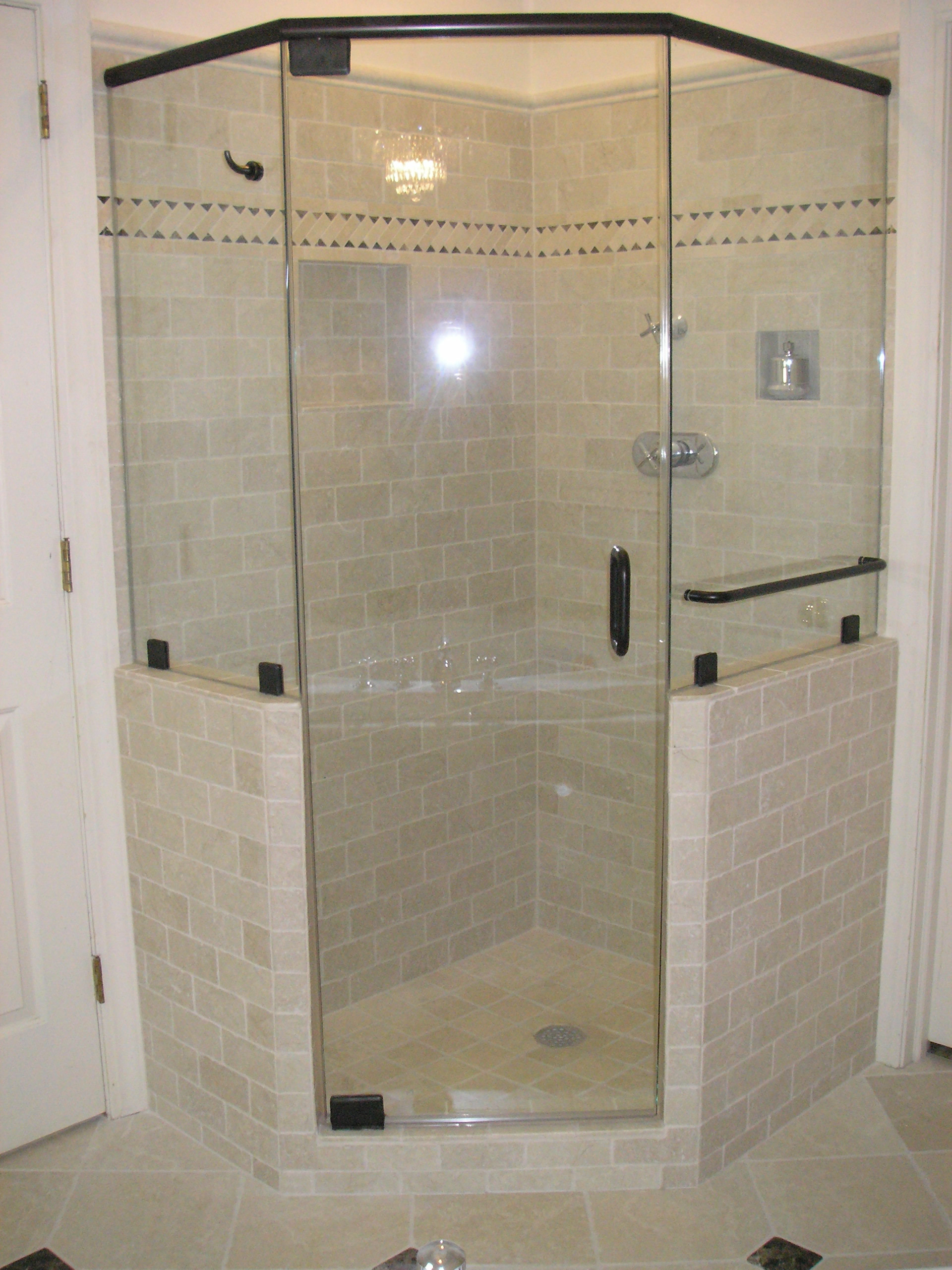 frameless shower enclosure with header